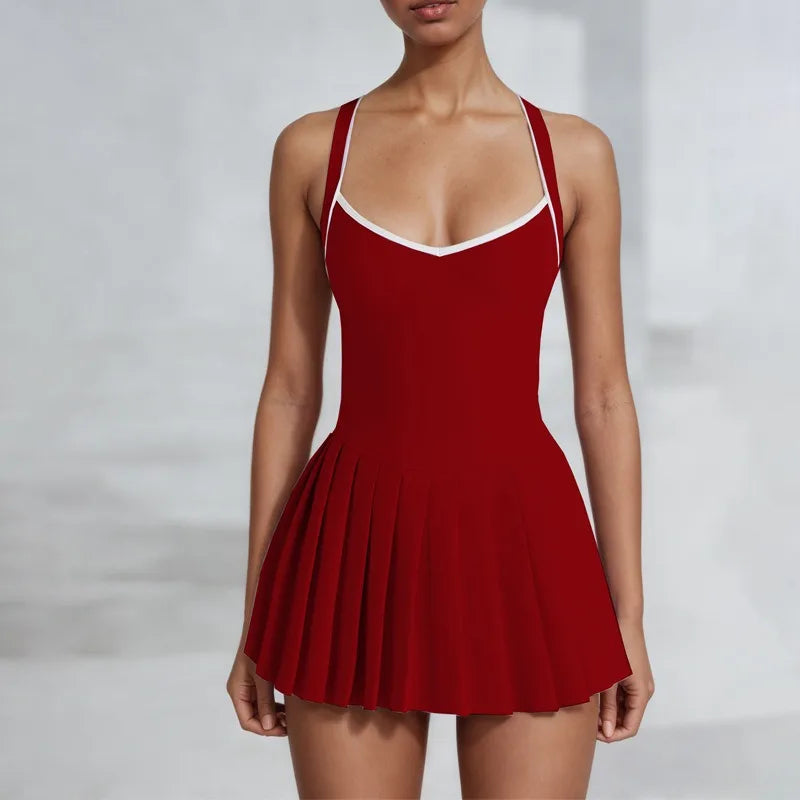 Xooie Fit red pickleball dress with built-in shorts featuring a flattering pleated design