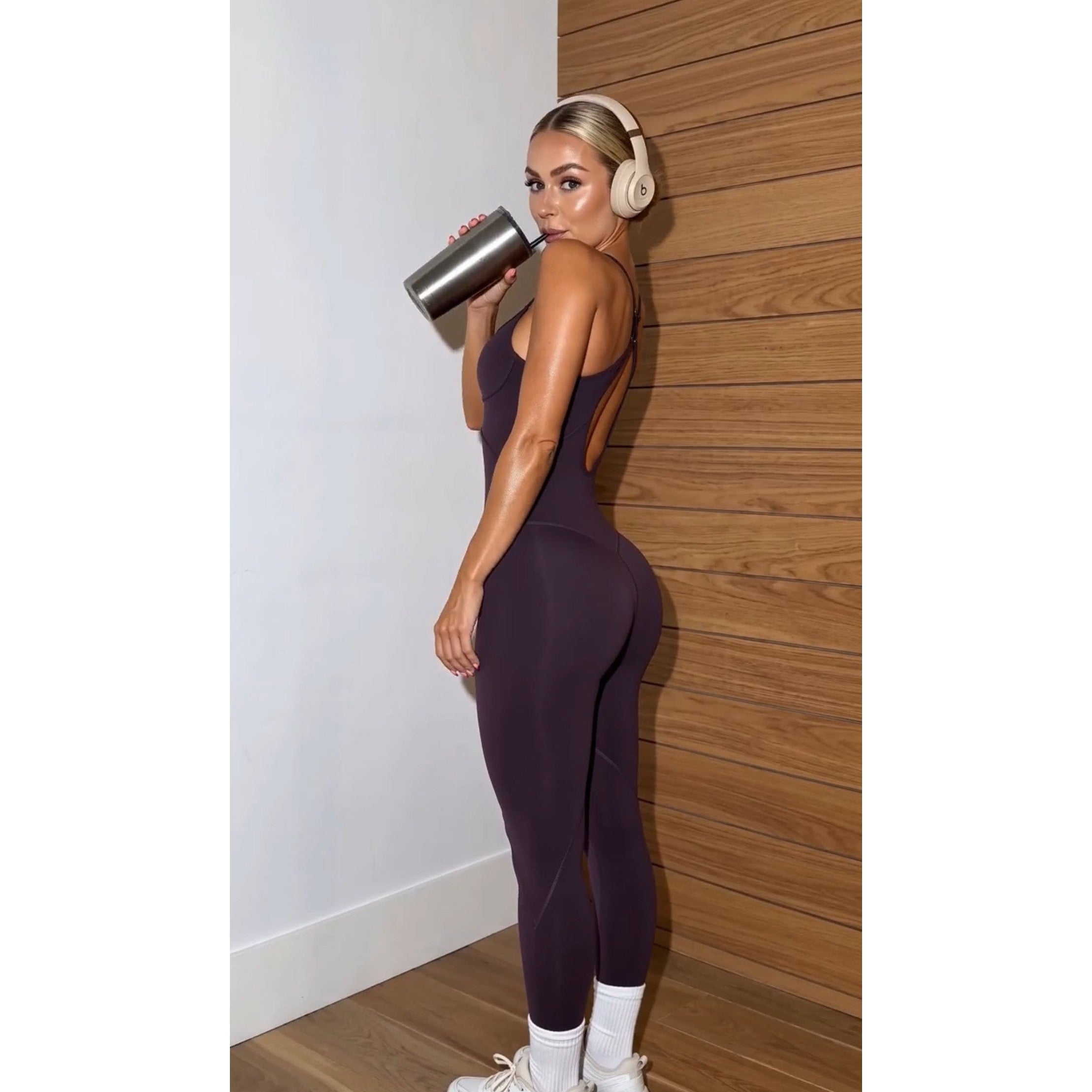 Purple fitted jumpsuit with scoop front and criss-cross open-back straps