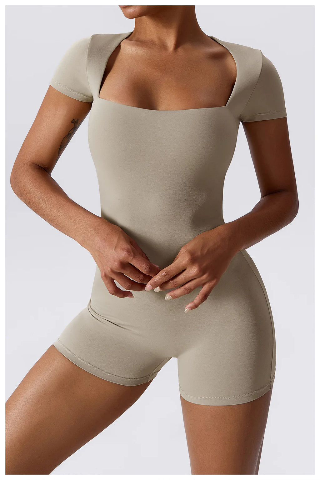 Beige short-sleeve one-piece yoga suit with square neckline and fitted shorts