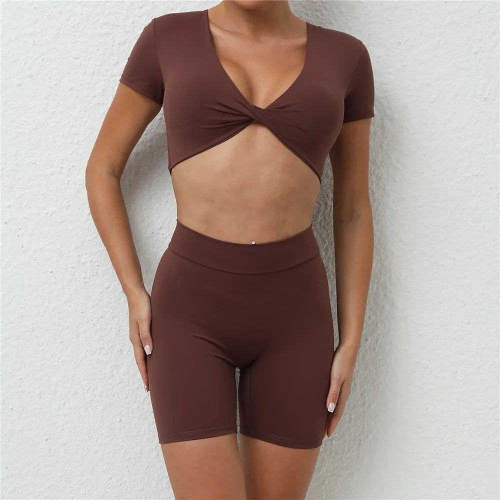 Xooie Fit short sleeve crop top and shorts set in brown with twist front design and high-waisted shorts