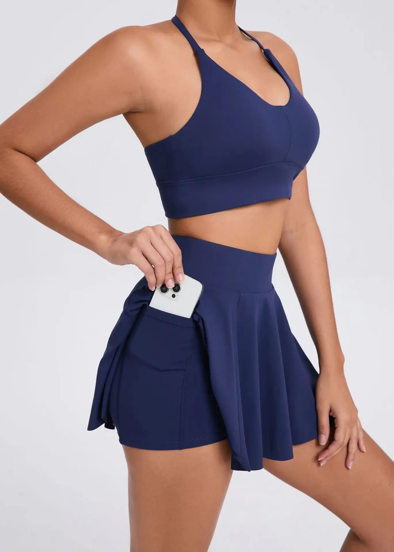 Xooie Fit sport bra and skort with pockets in BLUE for activewear style and comfort POCKET VIEW