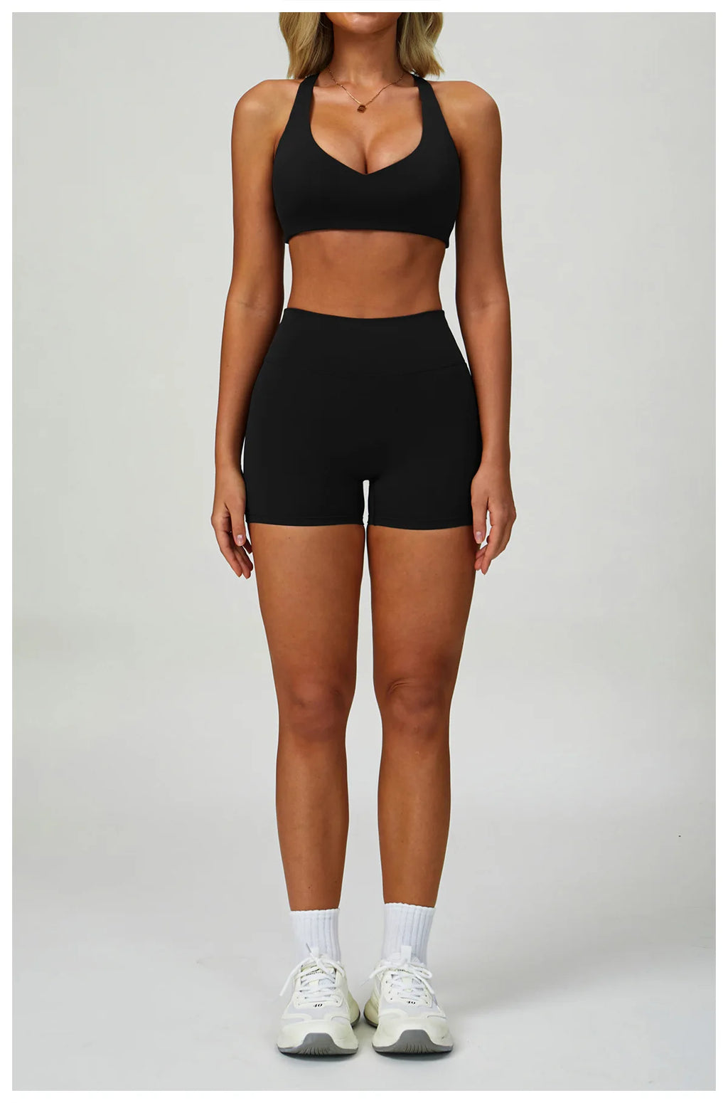 High-intensity sports bra, black, wide straps and V-neckline