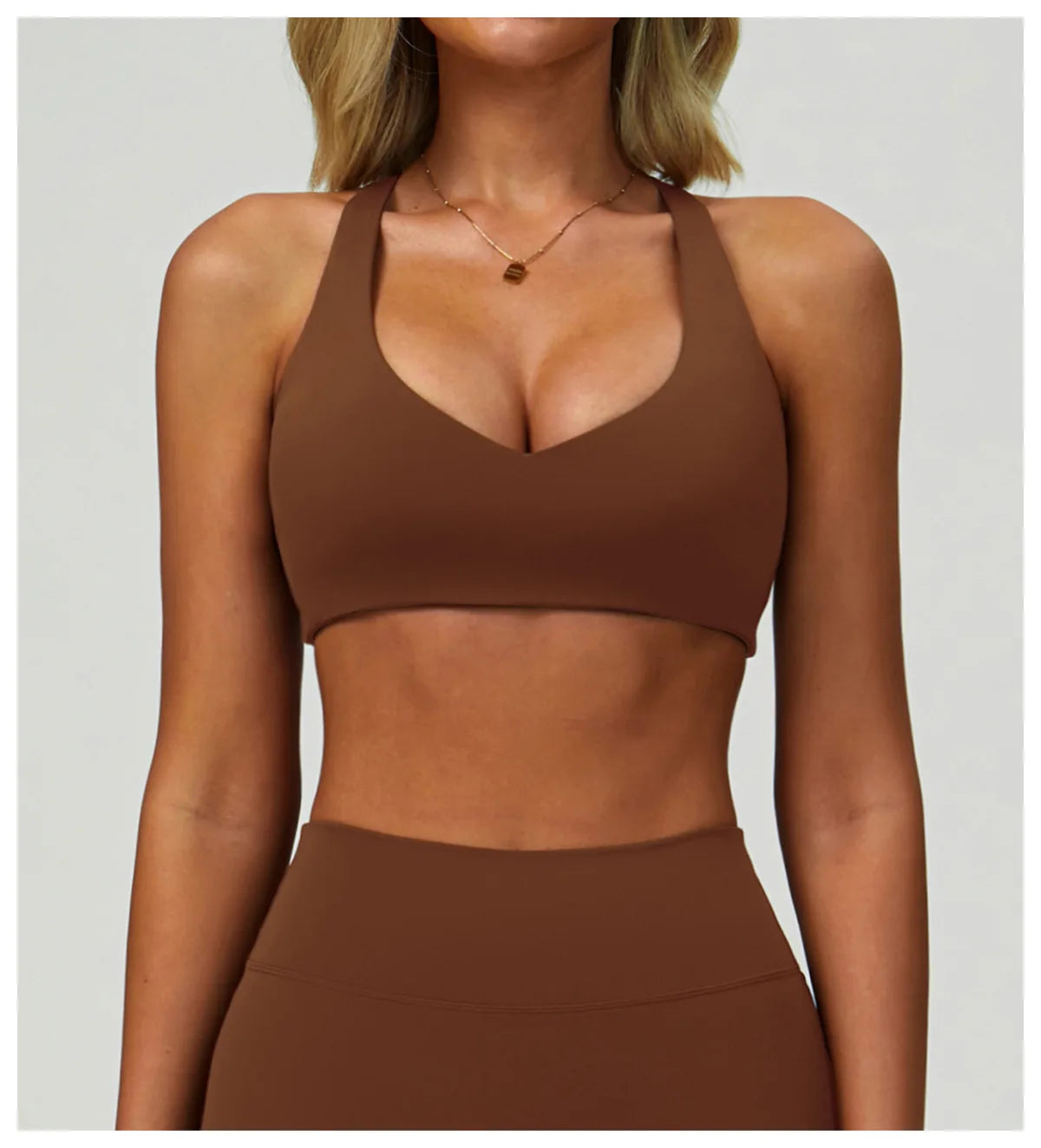 Brown high-support sports bra with wide V-neck and smooth stretch fabric.