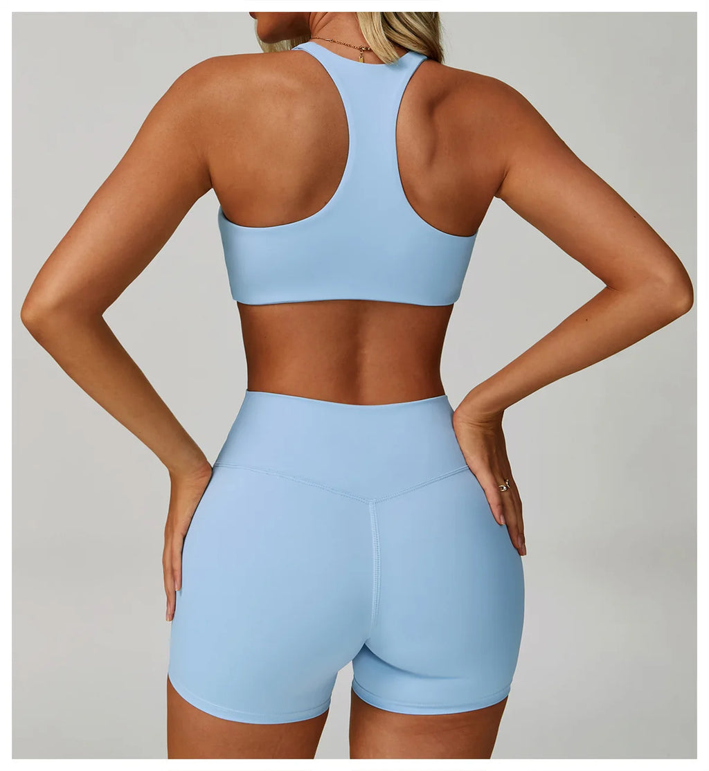 Sky blue high-support sports bra, racerback with full back coverage.