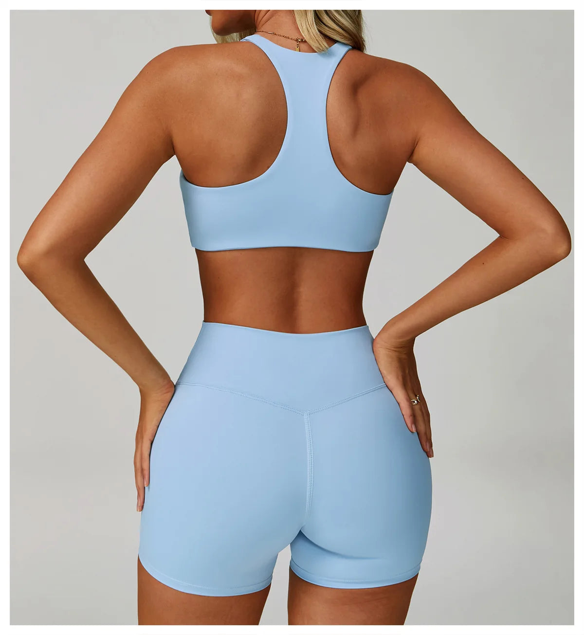 Sky blue high-support sports bra, racerback with full back coverage.
