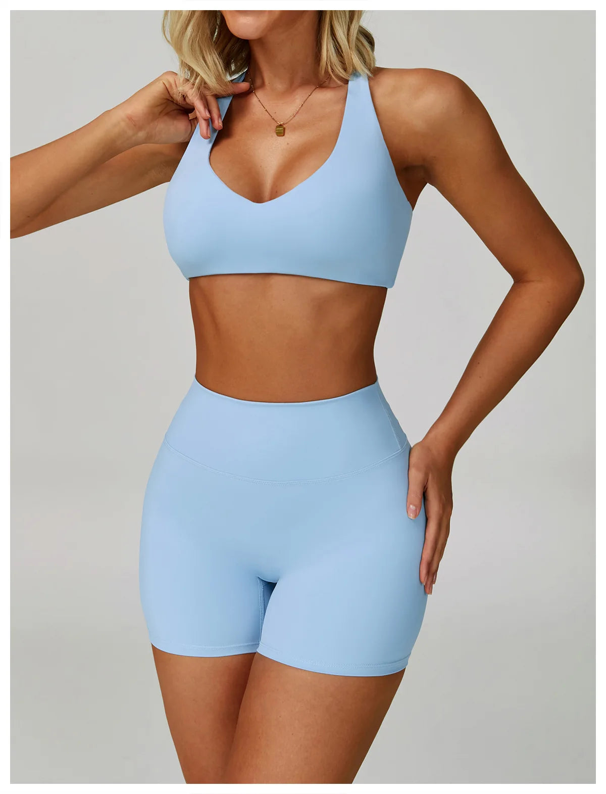 Sky blue high-support sports bra with V-neck front and wide straps.