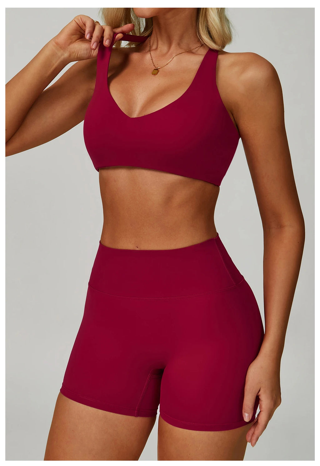 Rose red high-support sports bra with V-neck front and racerback straps.