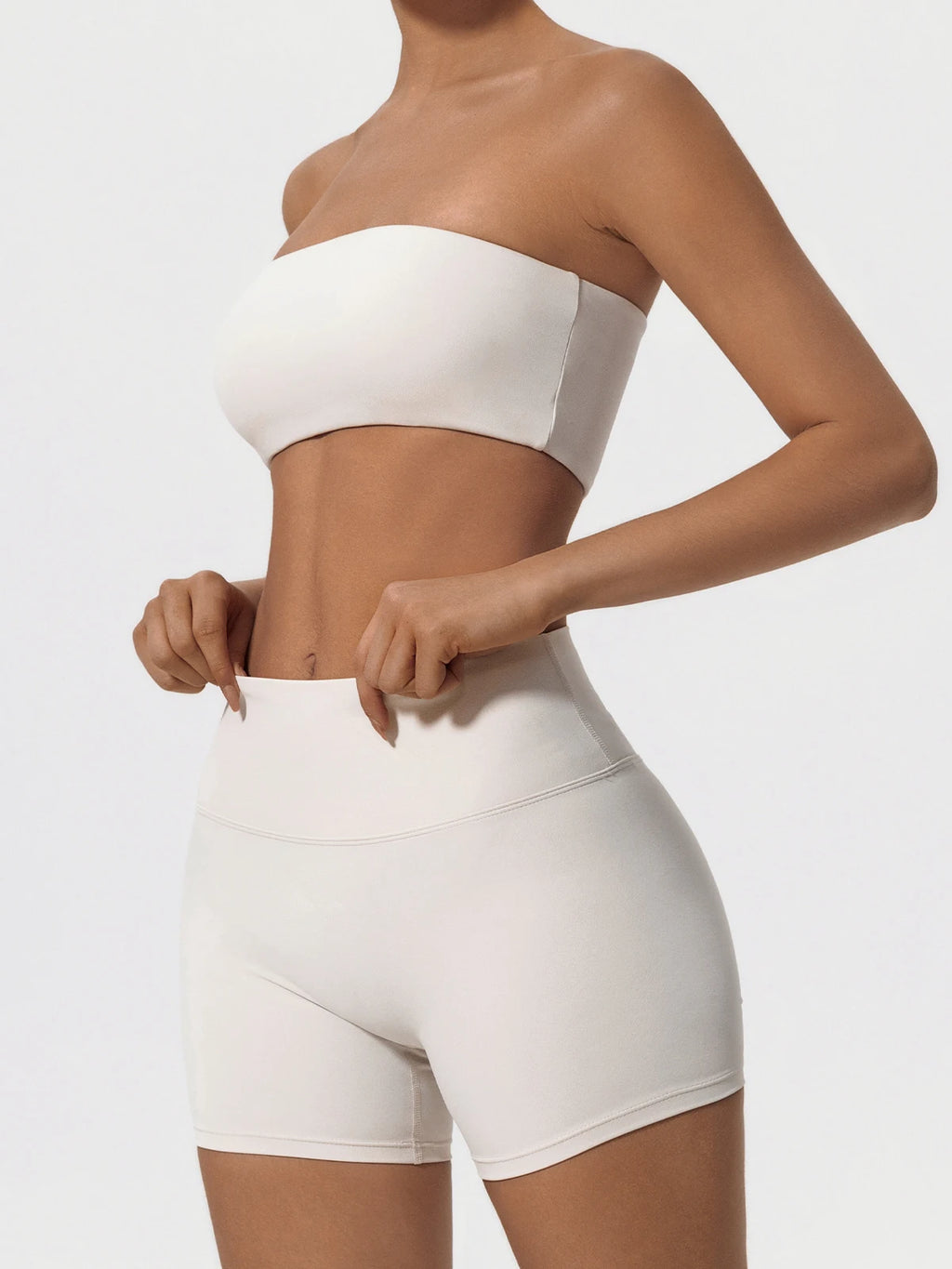 Women’s ivory strapless sports bra and high-waist biker shorts set