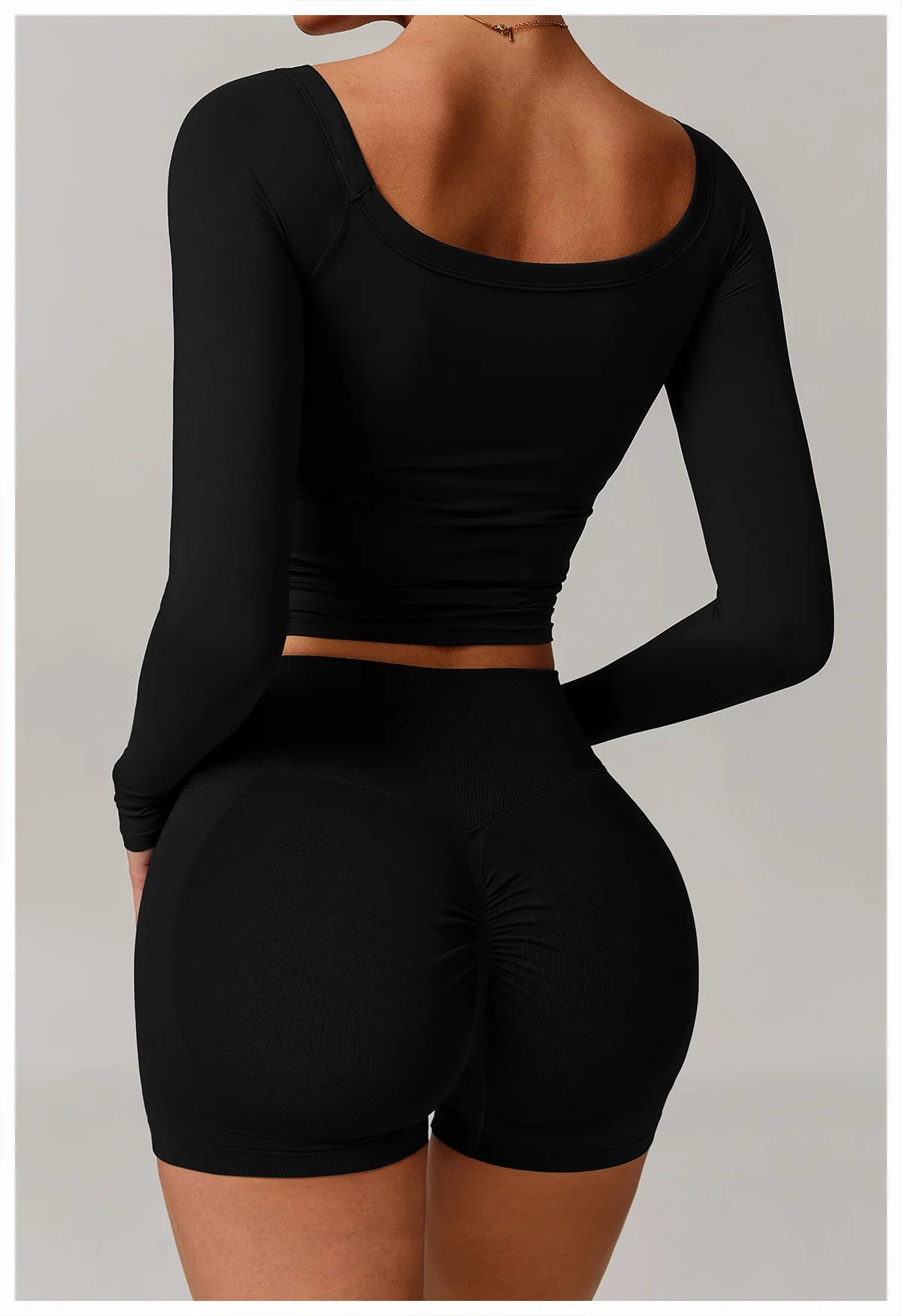 Xooie Fit stretchy long-sleeve workout shirt in black fitted design for activewear back view