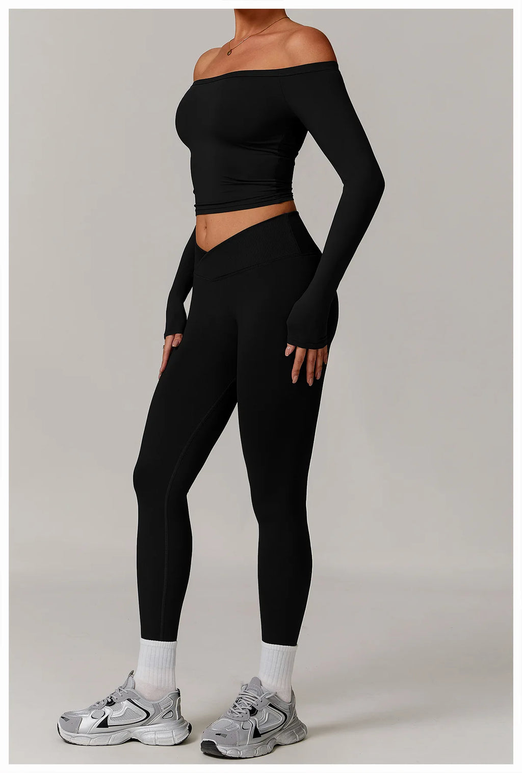 Xooie Fit stretchy long-sleeve workout shirt in black fitted design for activewear full view