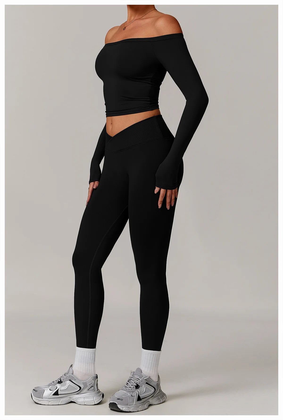 Xooie Fit stretchy long-sleeve workout shirt in black fitted design for activewear full view