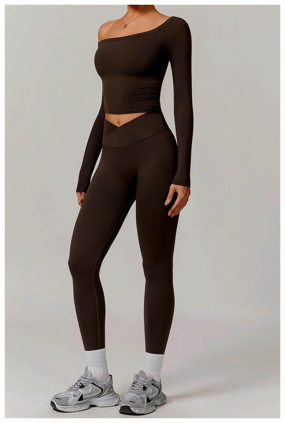 Xooie Fit stretchy long-sleeve workout shirt in dark brown with slim fit and asymmetrical neckline