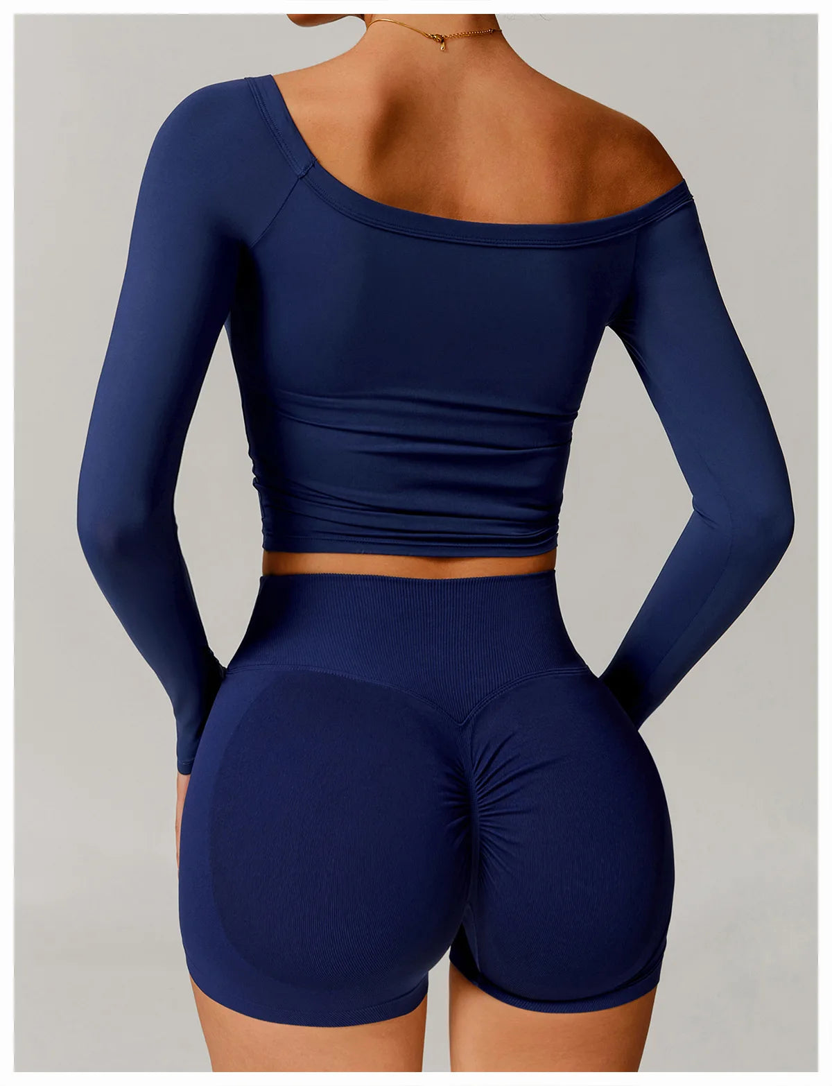 Xooie Fit navy blue stretchy long-sleeve workout shirt with asymmetrical off-shoulder design
