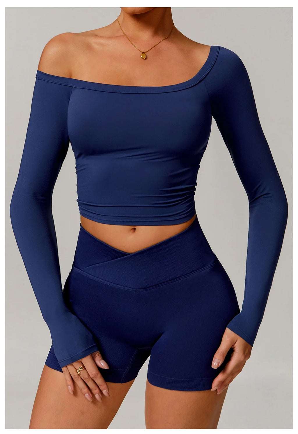 Xooie Fit navy blue stretchy long-sleeve workout shirt with off-shoulder design
