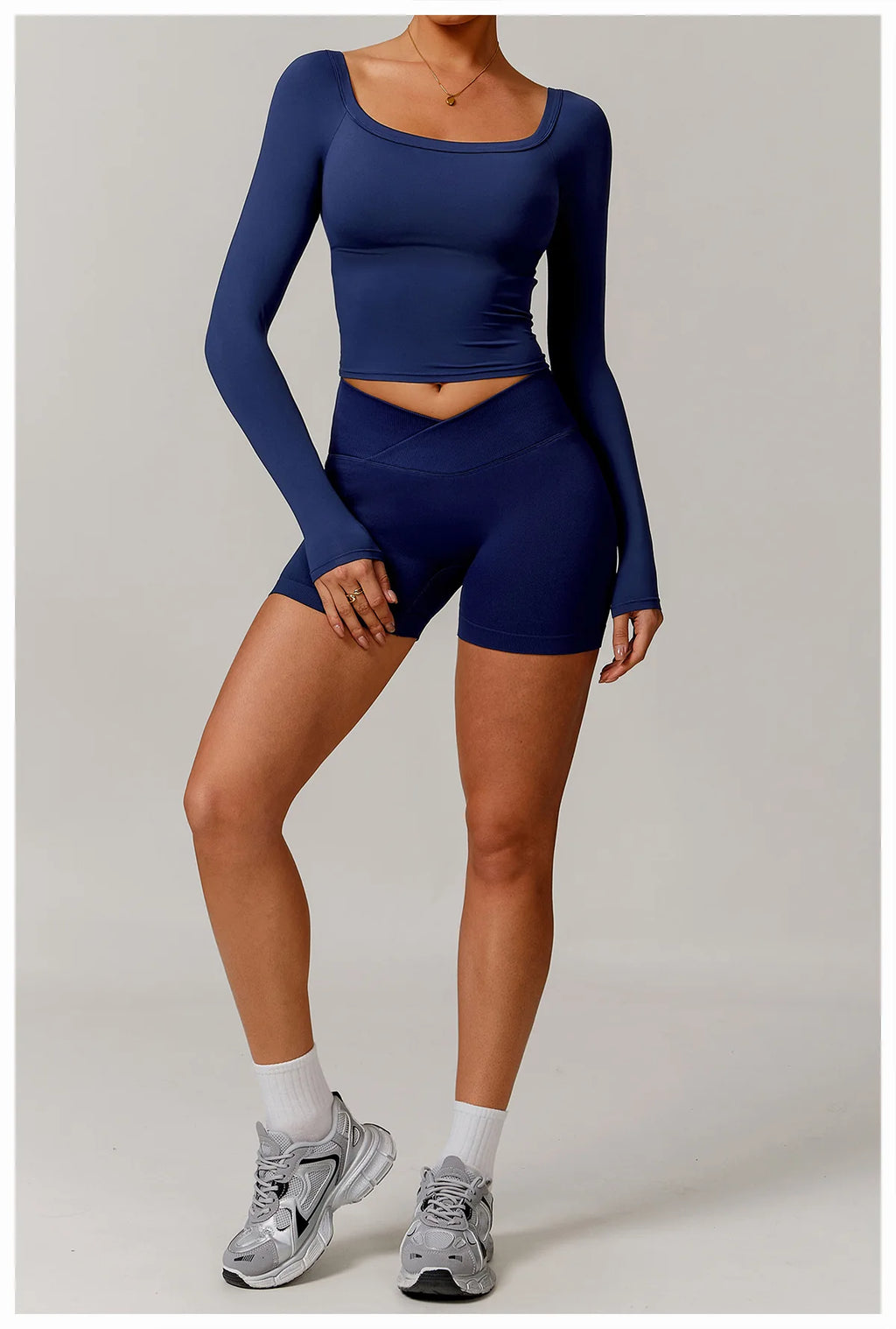 Xooie Fit stretchy long-sleeve workout shirt in navy blue paired with matching shorts