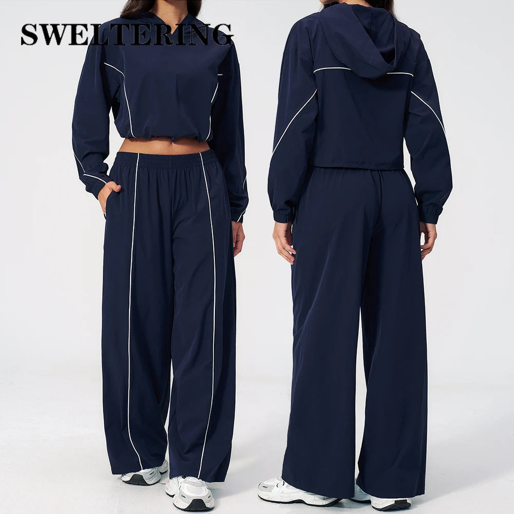 Women’s navy hooded sports set with light piping, cropped jacket and wide-leg pants