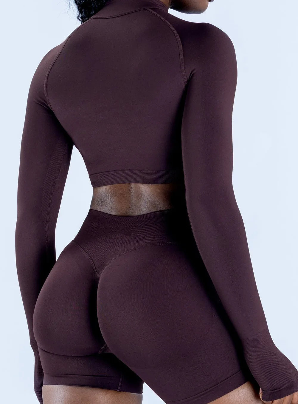 Xooie Fit women's zip crop top long sleeve in brown, featuring a stylish design for activewear