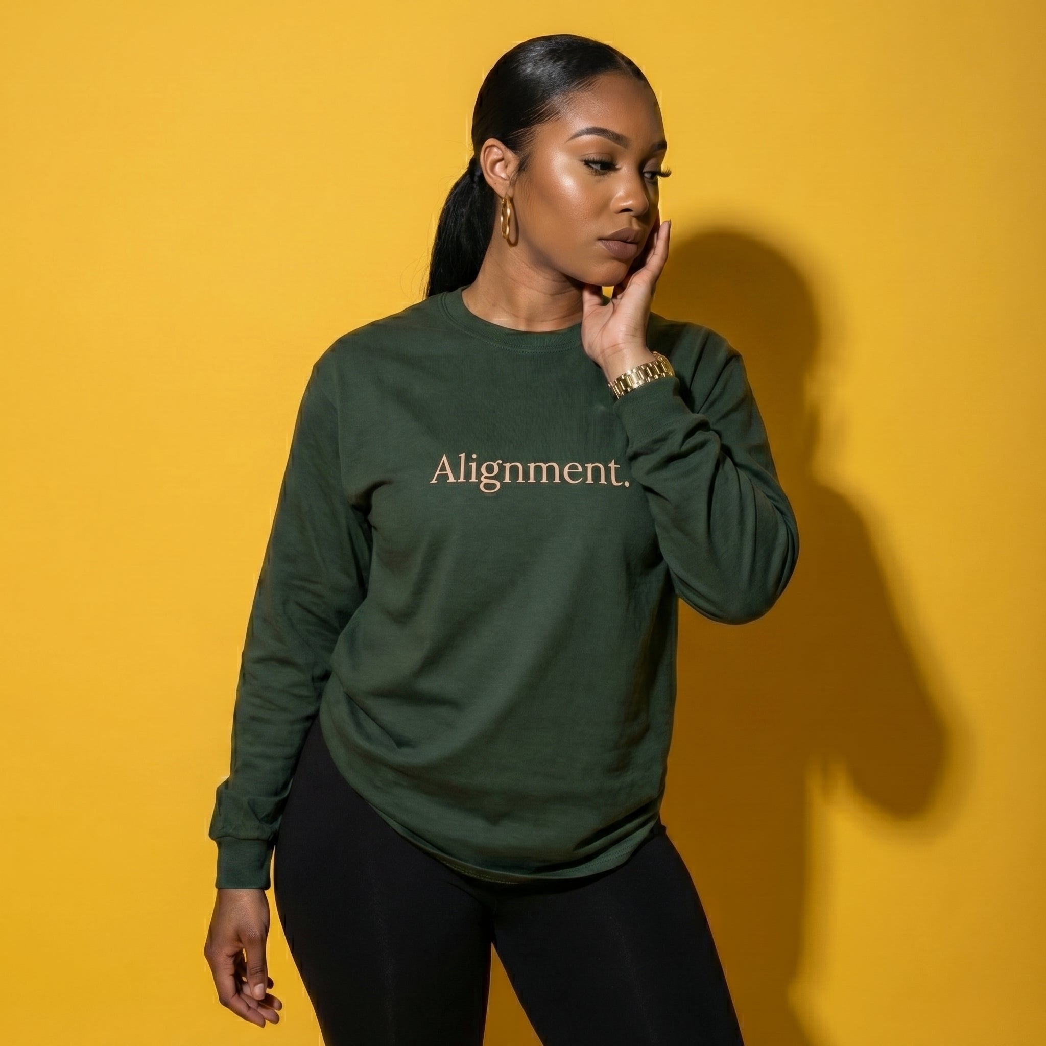 Jungle green long-sleeve unisex tee with “Alignment” graphic on the front