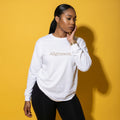 White long-sleeve tee with 'Alignment.' text graphic, model portrait view