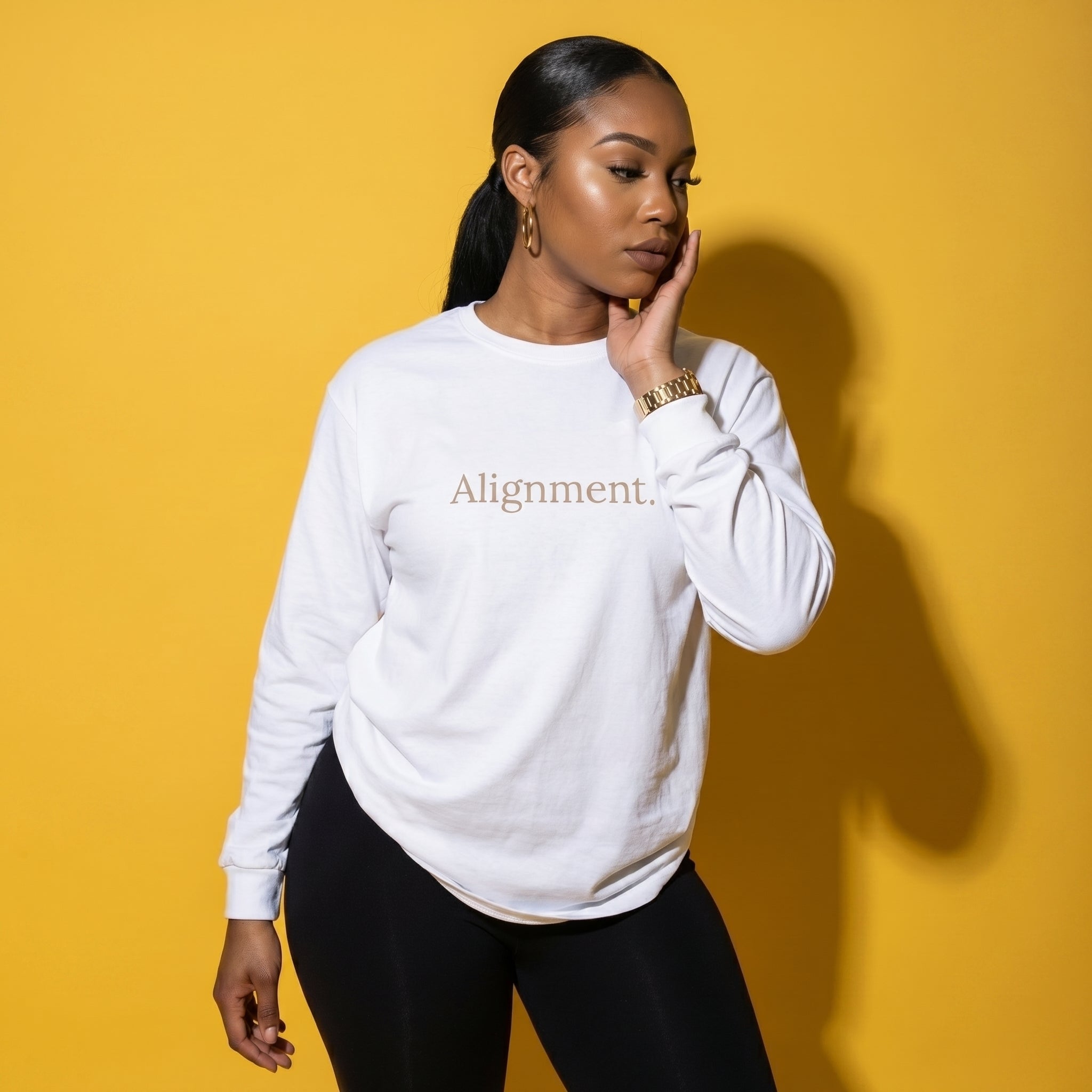 White long-sleeve unisex tee with “Alignment” graphic on the front