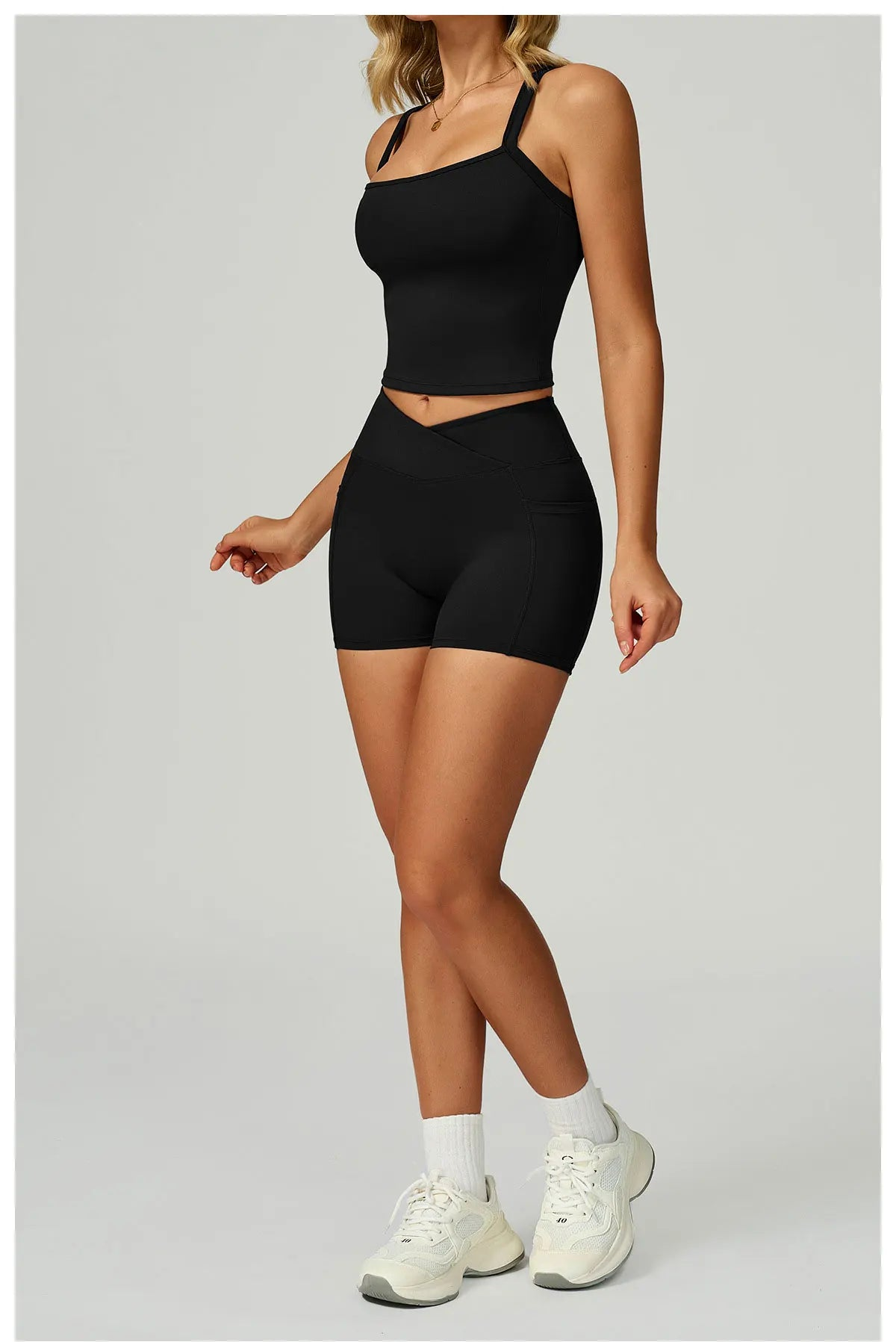 Black fitted spaghetti strap tank top and matching shorts, active set