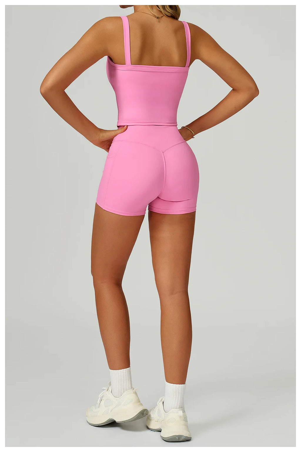 Pink matching active set: strappy tank back view and high-waist shorts