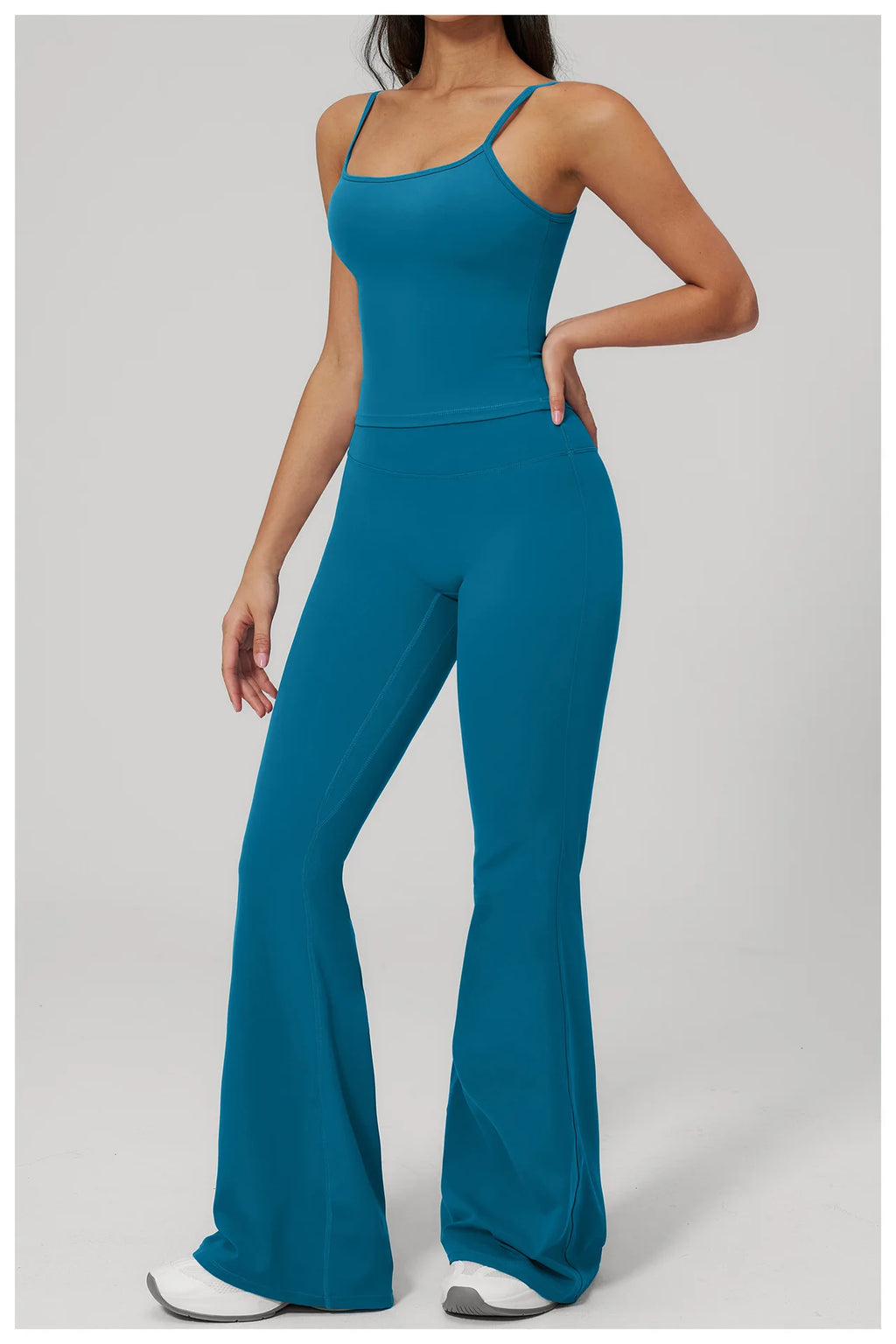 Women's peacock blue sports set, side view: racerback tank and wide-leg leggings