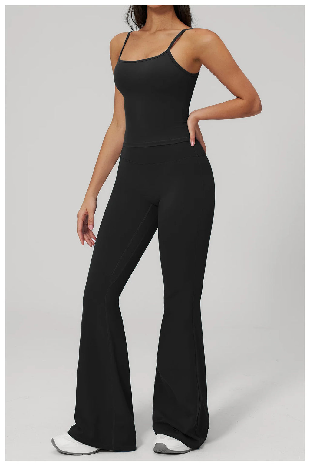 Black sports set: tank bra with thin straps and bell-leg leggings, side front view