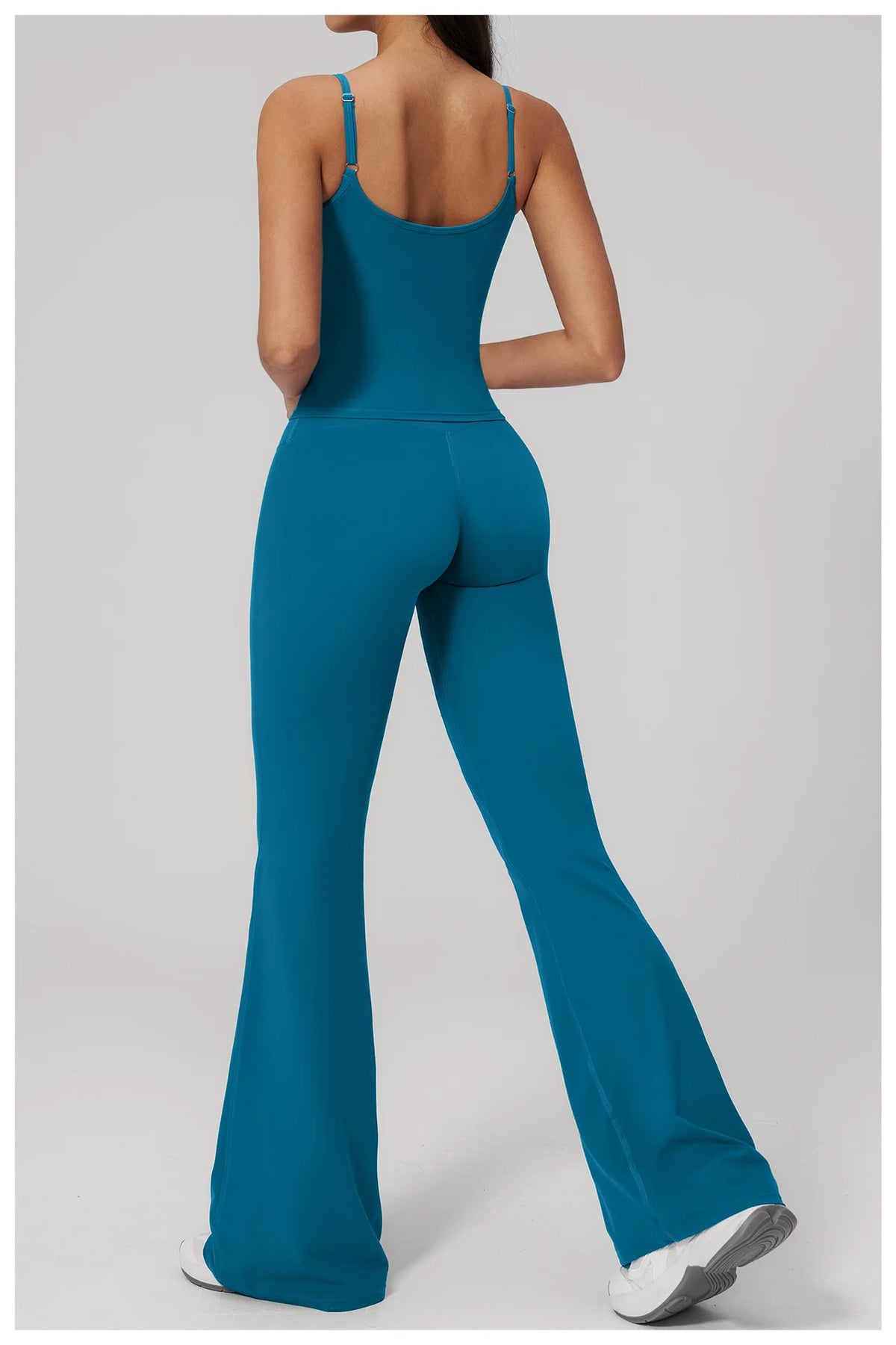 Peacock blue sports set: racerback tank bra and flare leggings, full back view