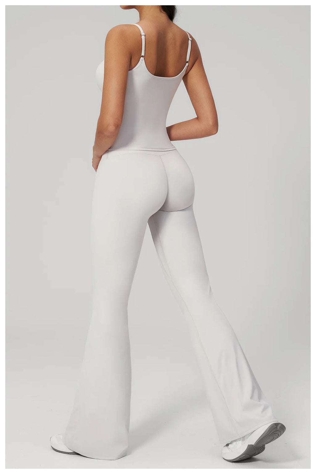 White sports set: racerback tank bra and flare leggings, full back view