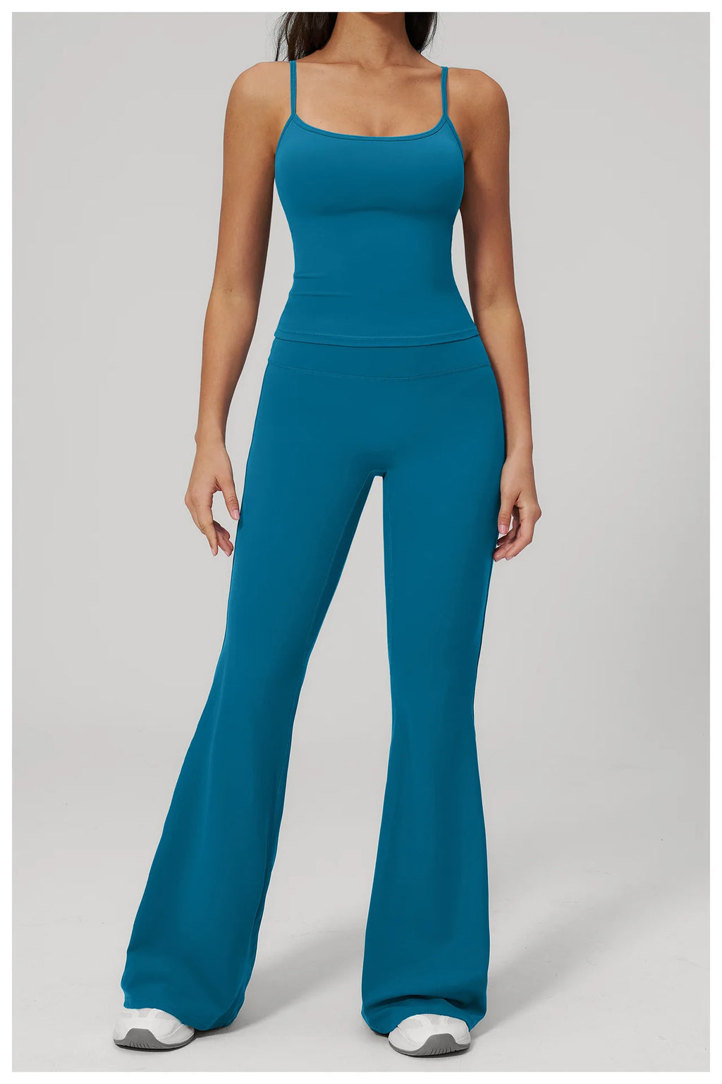 Peacock blue sports set: scoop-neck tank bra and flare leggings, full front