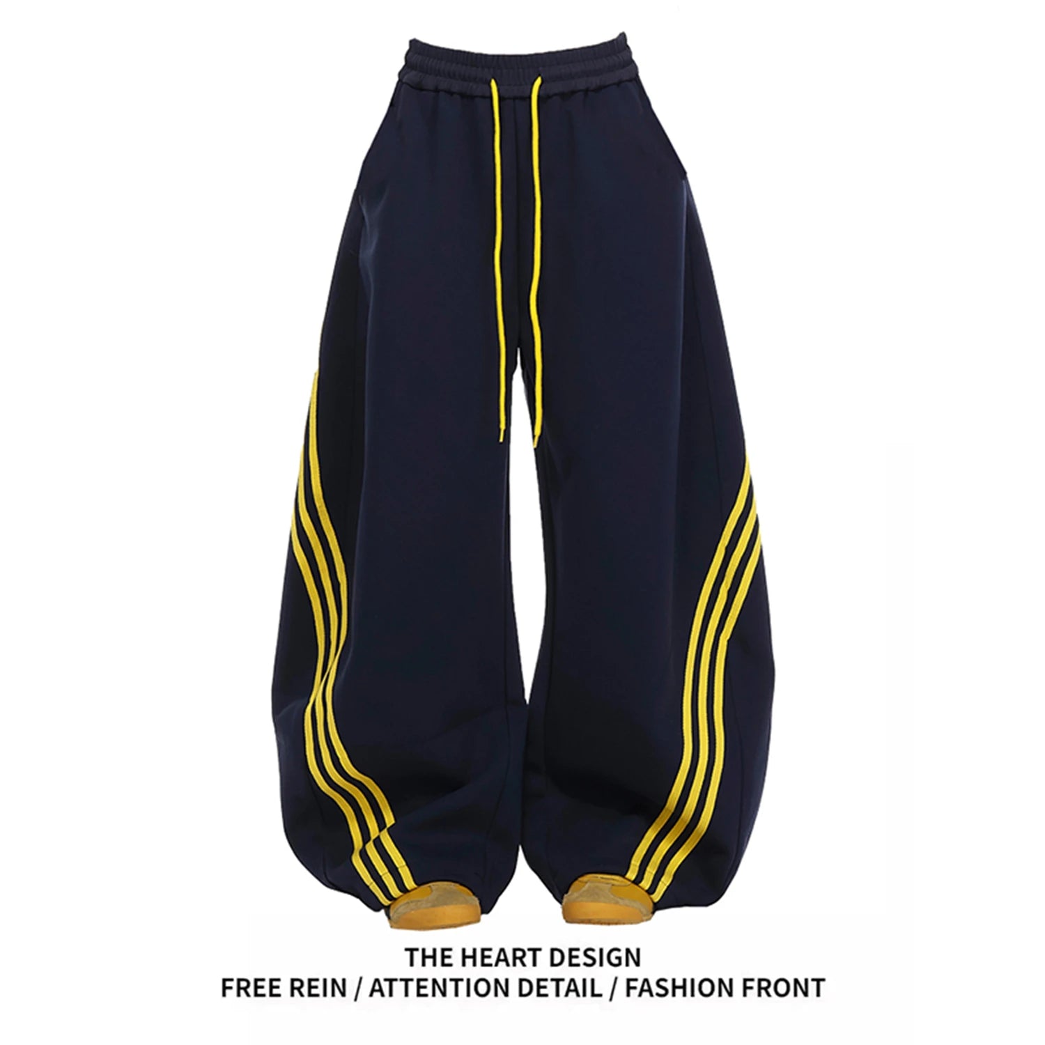 Wide-leg sweatpants in dark navy with yellow side stripes and drawstring waist.