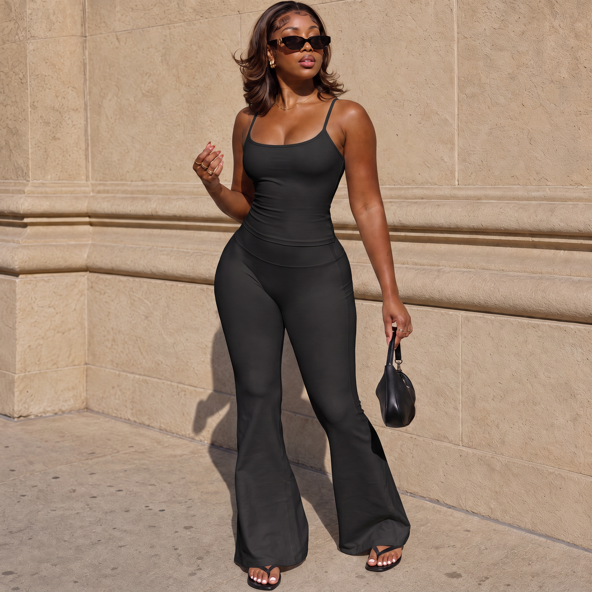 Black spaghetti strap tank and flared high-waisted pants matching set