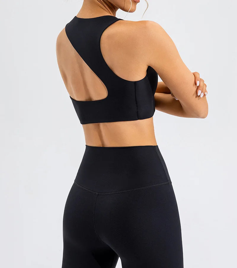 Xooie Fit black unique open-back bralette with modern cutout design worn by model from the back