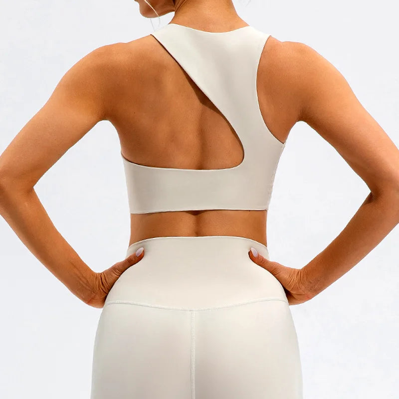 Xooie Fit beige unique open-back bralette with asymmetric straps and smooth fabric back view