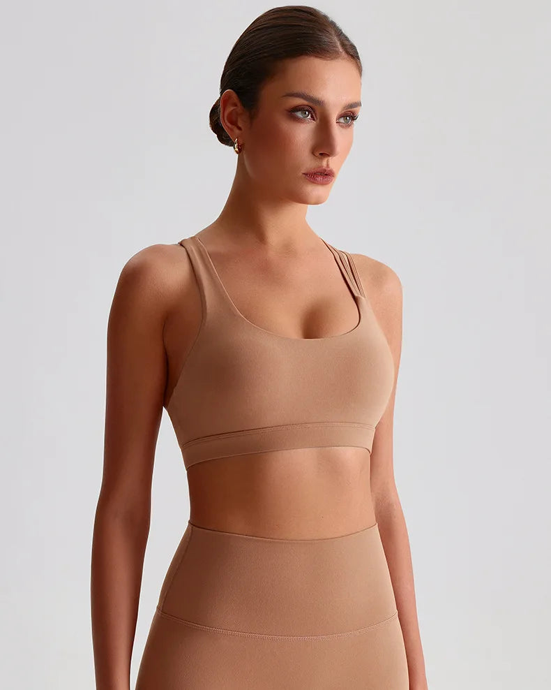 Xooie Fit unique strappy sports bra for women in tan color, designed for comfort and support