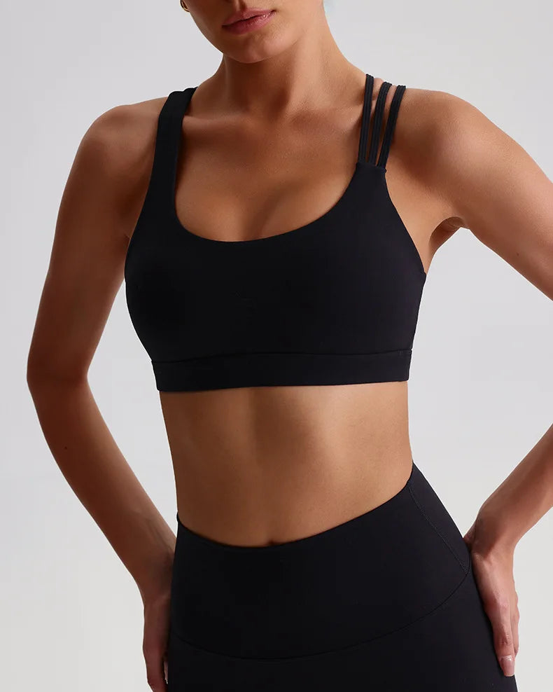 Unique strappy sports bra for women in black featuring sleek design and comfortable fit
