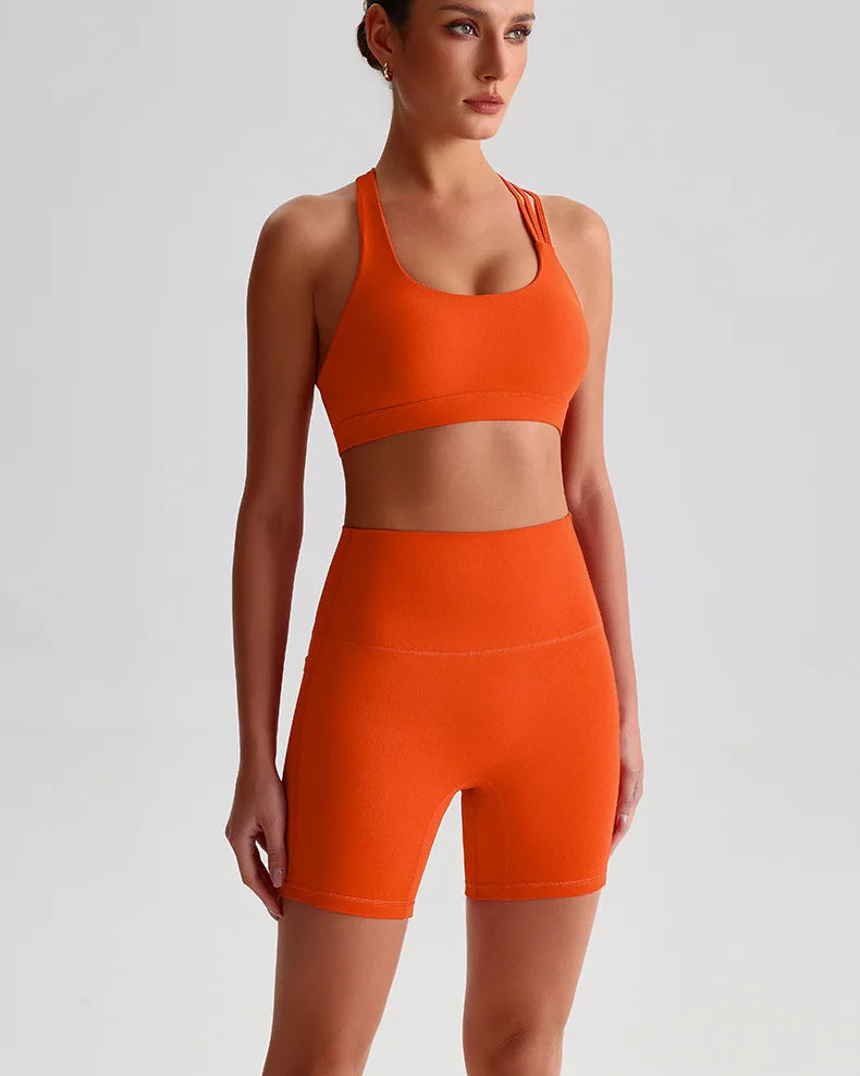 Xooie Fit unique strappy sports bra for women in vibrant orange for stylish workouts