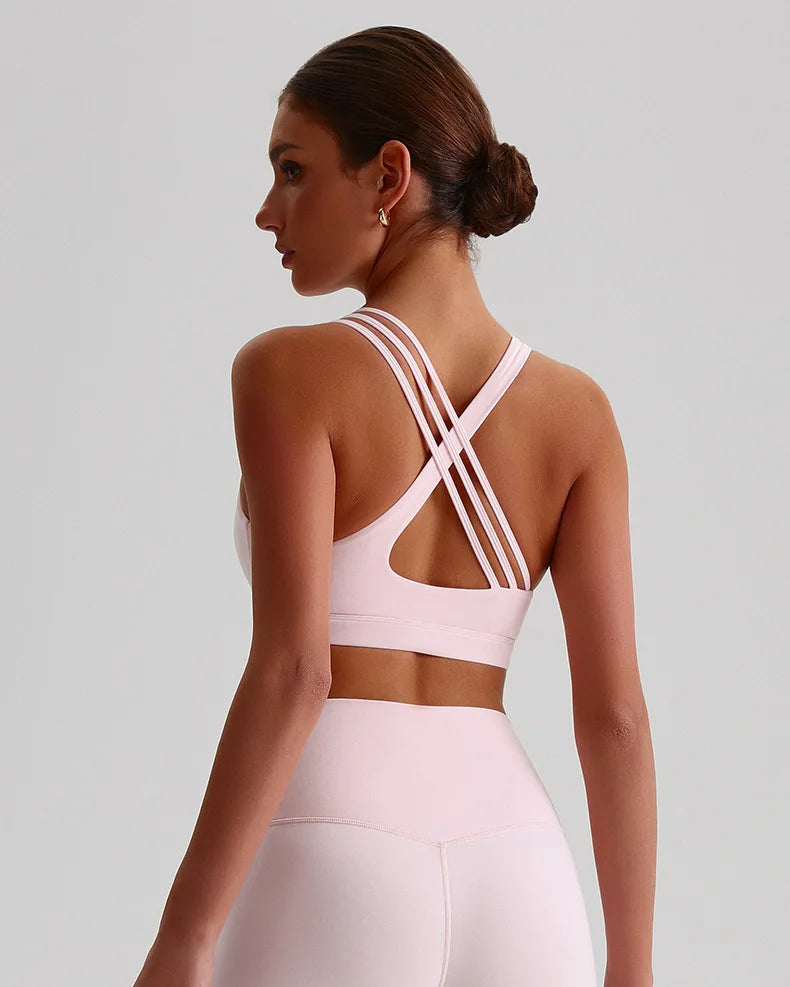 Xooie Fit unique strappy sports bra for women with stylish back design in soft pink color