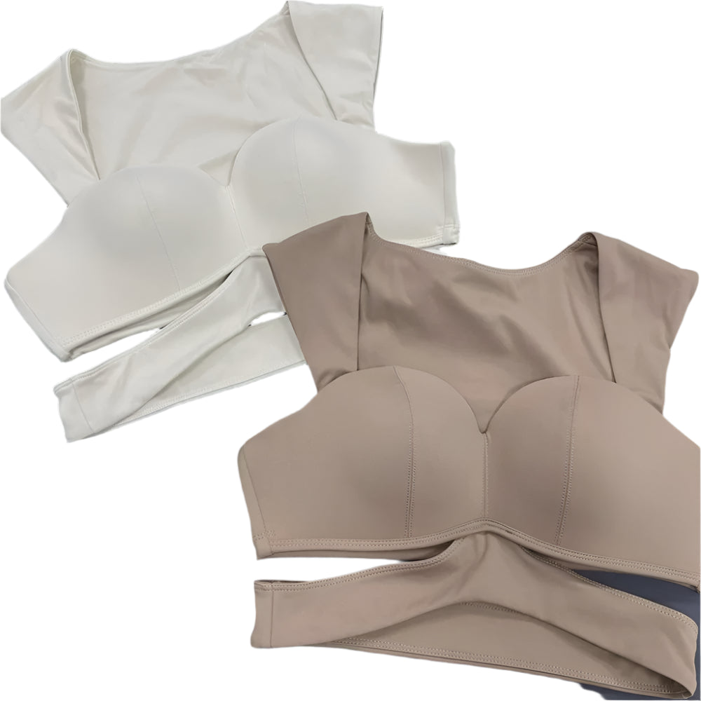 Two Xooie Fit unique yoga bras in beige and white with stylish cutout designs for comfortable workouts