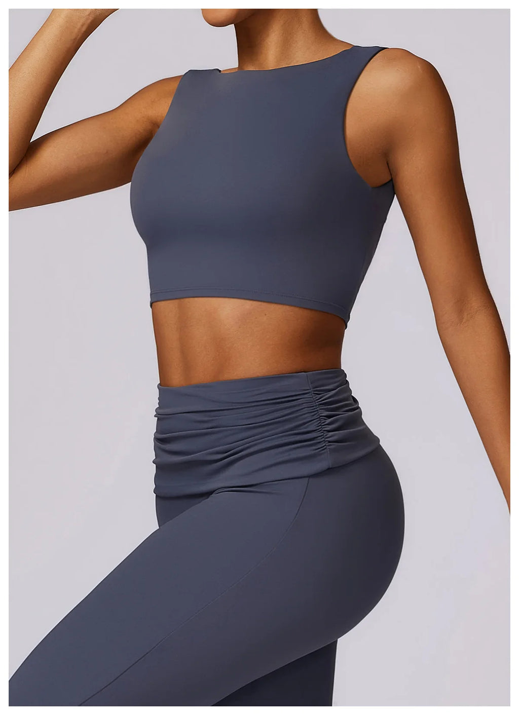 Women’s navy sleeveless sports bra crop top with ruched waistband detail