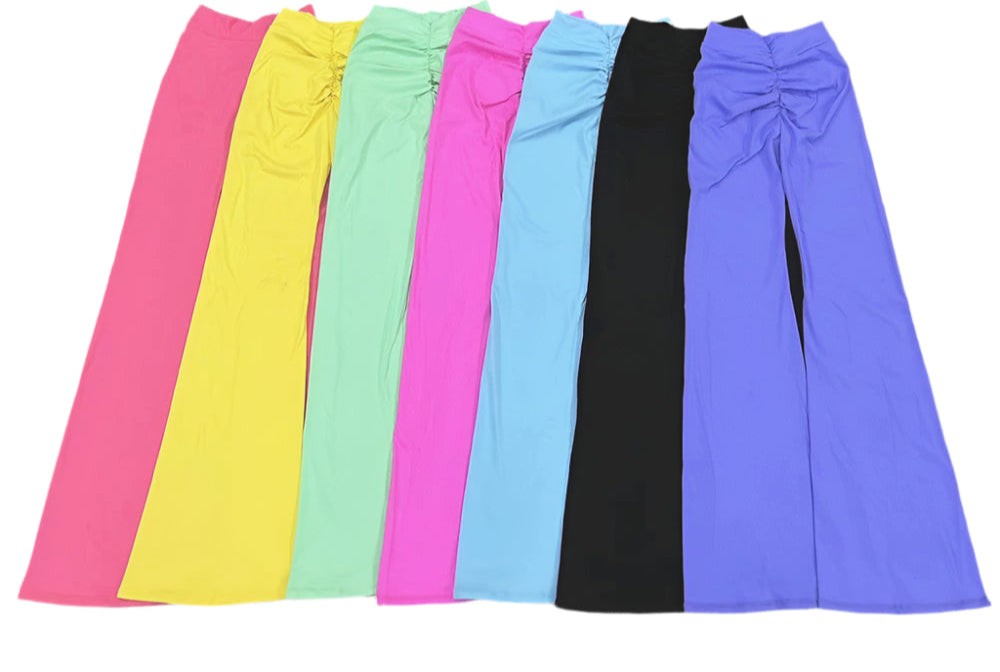 Colorful Xooie Fit v-shaped flare fitness leggings in pink, yellow, green, and black displayed in a row