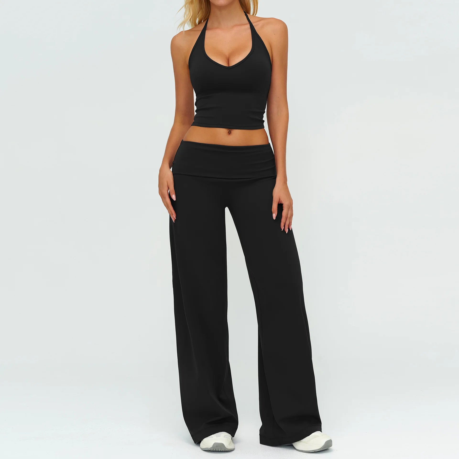 Black halter strap tank top with matching wide-leg flare pants, active set