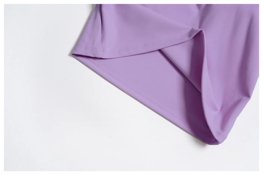 Purple fabric close-up: smooth athletic knit with clean seams