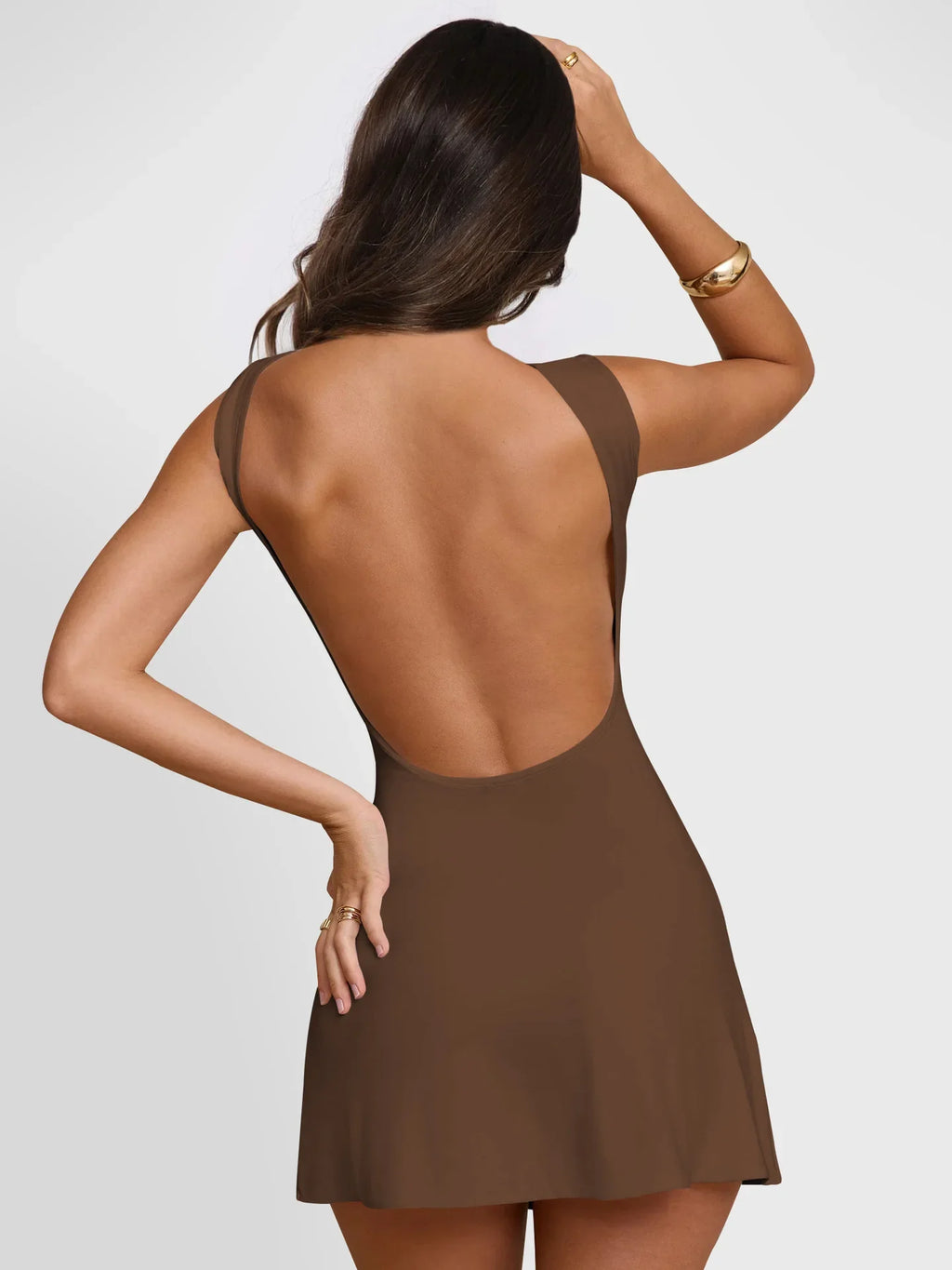Brown Xooie Fit active mini backless dress with a stylish deep back for a chic look