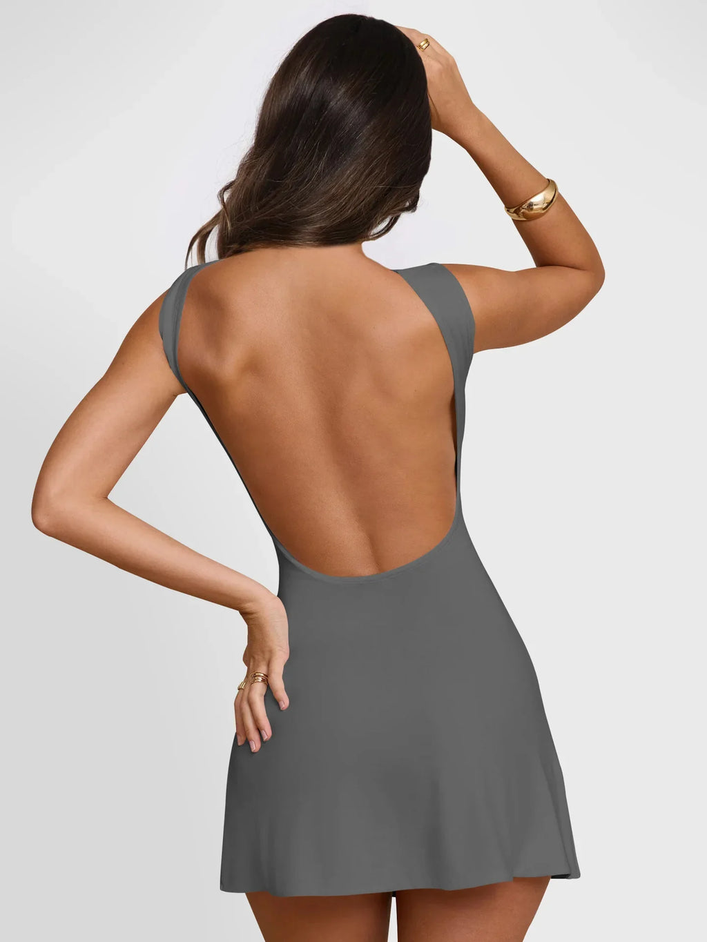 Xooie Fit active mini backless dress in gray, showcasing a sleek open back design