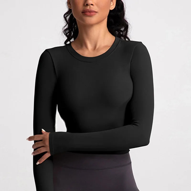 Xooie Fit backless long sleeve workout crop top in black, perfect for fitness enthusiasts