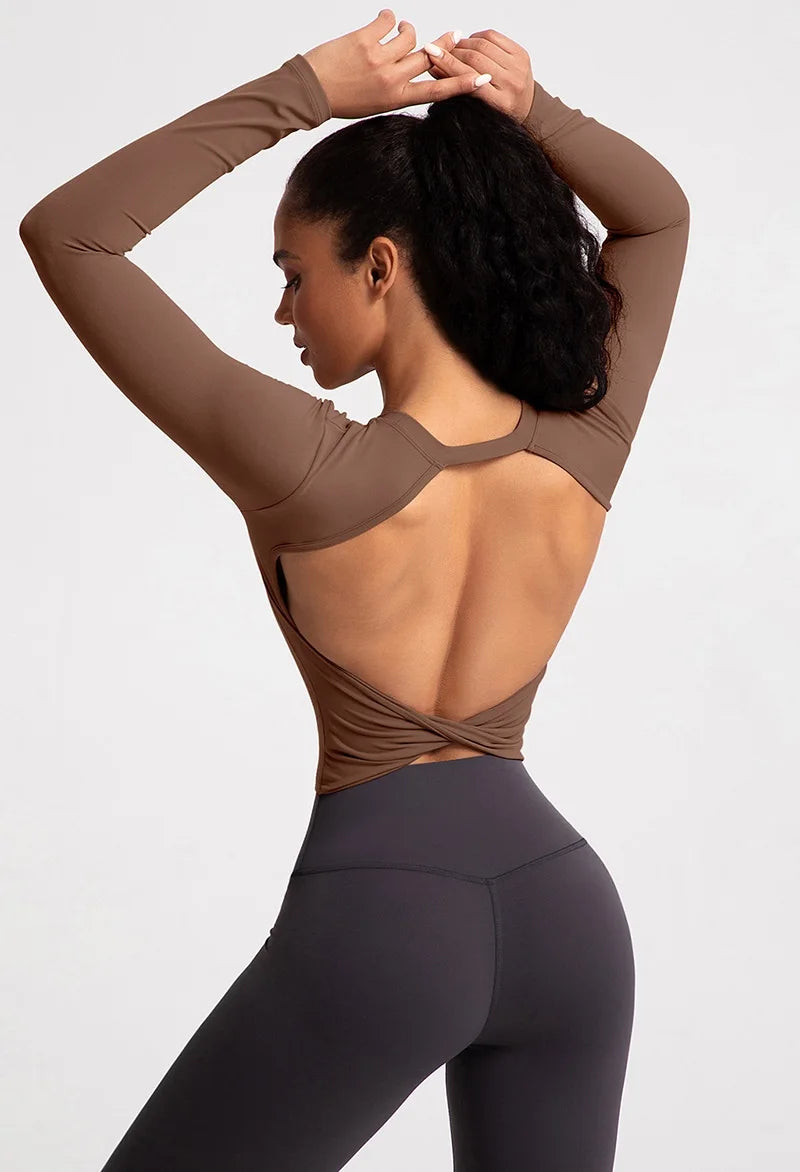 Backless long sleeve workout crop top in brown with stylish open back design for flexibility