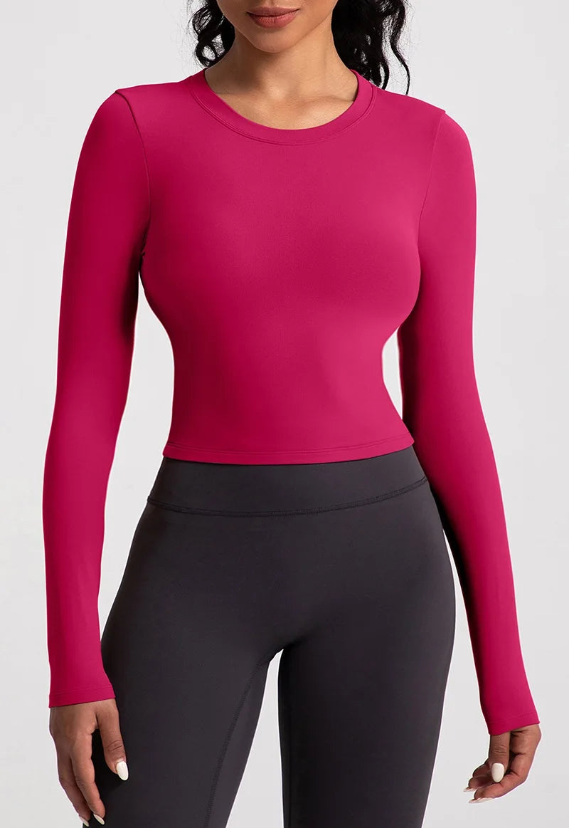 Xooie Fit backless long sleeve workout crop top in vibrant pink for stylish gym sessions