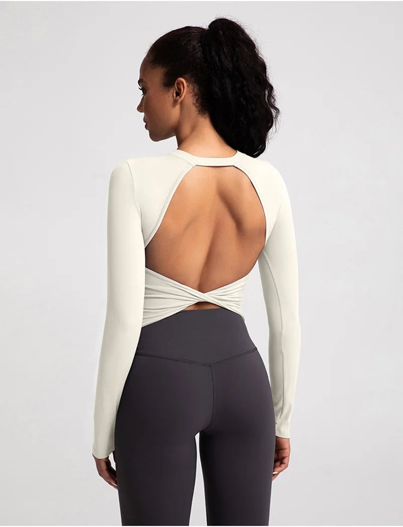 Xooie Fit backless long sleeve workout crop top in light color with stylish open back design